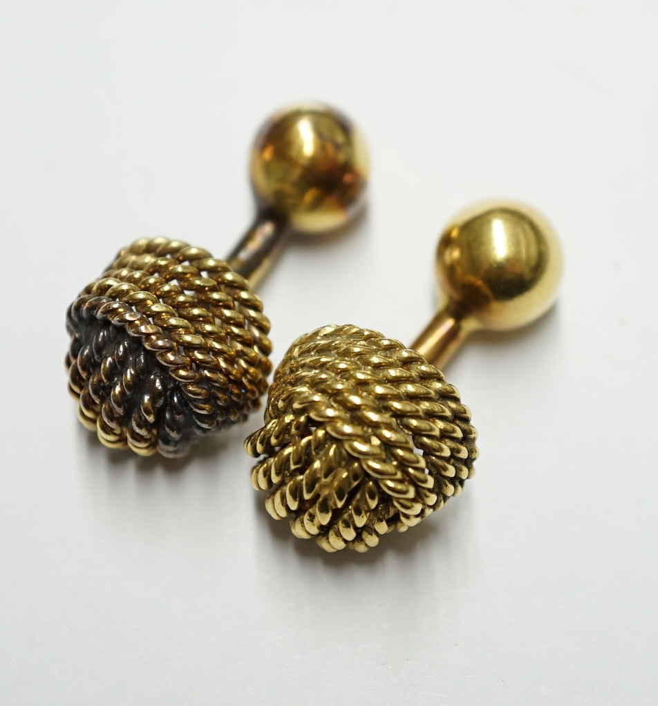 A French 18ct gold cufflink of rope twist design with ball terminals, 9.4 grams and an unmarked companion. Condition - fair